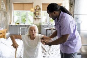 social-worker-taking-care-old-woman-1-300×200